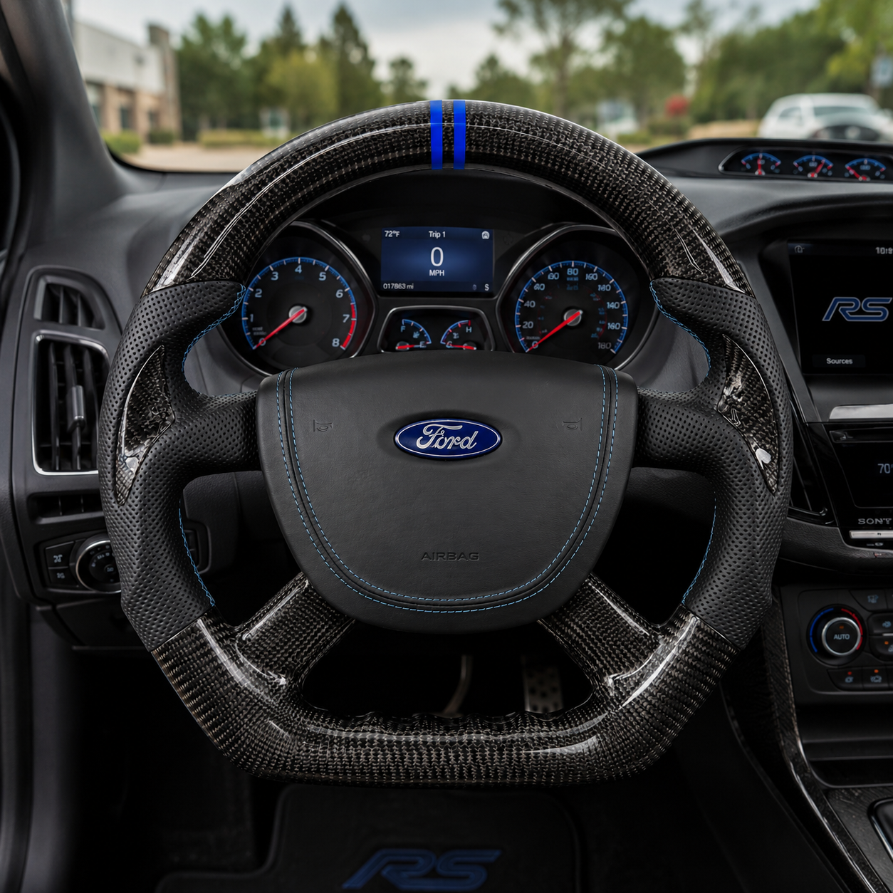 Ford Focus RS Mk3 custom carbon fiber steering wheel with perforated leather grips, blue center stripe, ergonomic finger grooves and premium cockpit installation by CJ Mod Garage