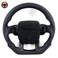 Custom steering wheel for Range Rover Evoque with black smooth leather, perforated leather side grips, Alcantara airbag cover and carbon fiber lower spoke trim