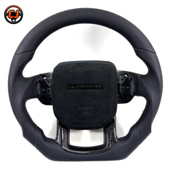 Custom steering wheel for Range Rover Evoque with black smooth leather, perforated leather side grips, Alcantara airbag cover and carbon fiber lower spoke trim