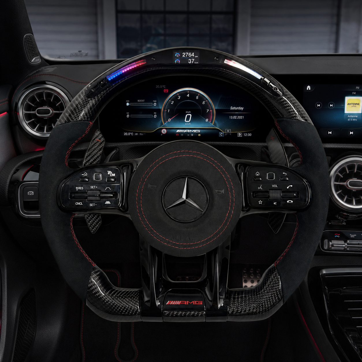 Mercedes AMG carbon fiber steering wheel with LED shift light, Alcantara grips and red stitching installed in W205 C63 C43 interior by CJ Mod Garage
