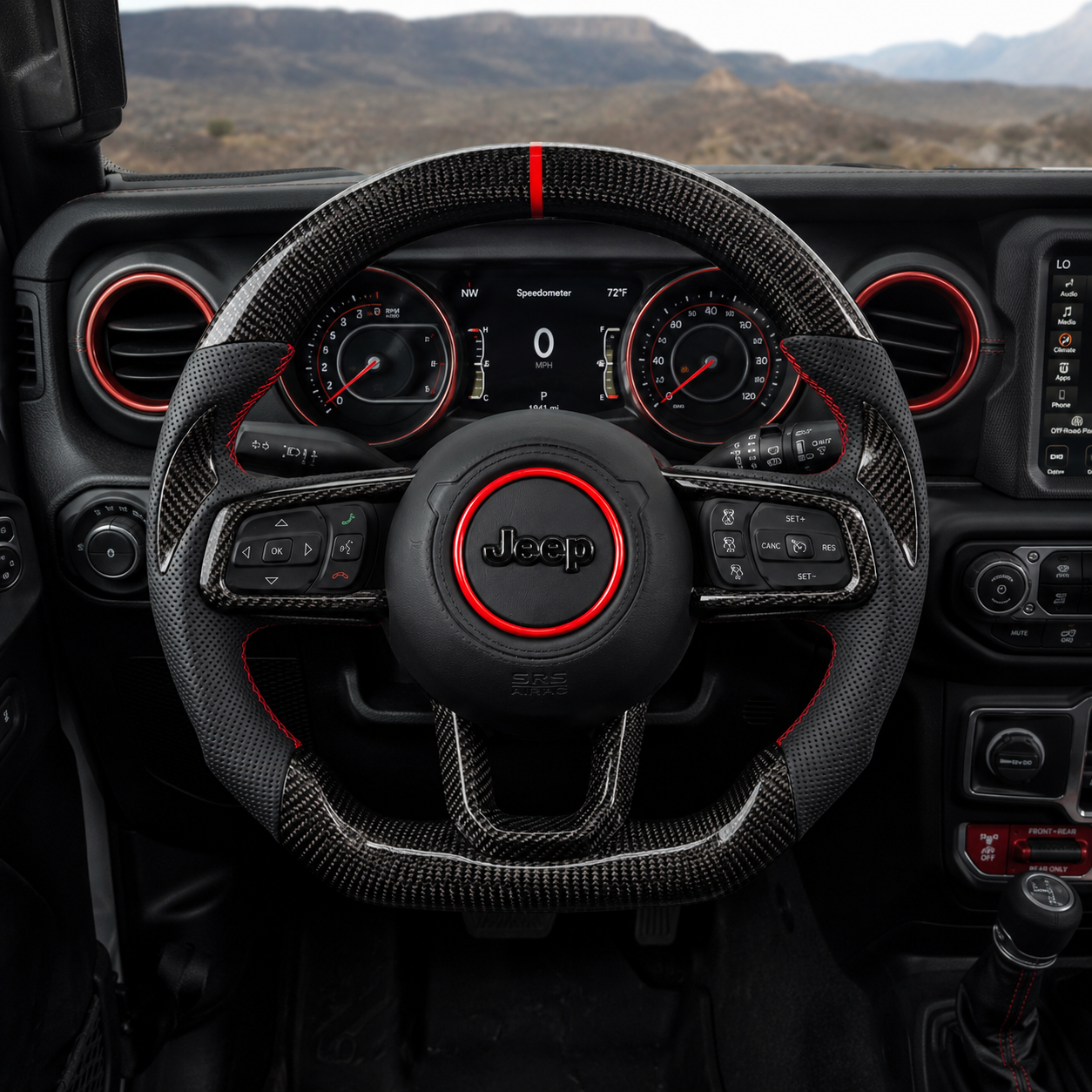 Front interior view of custom Jeep Wrangler carbon fiber steering wheel with glossy carbon fiber rim, black perforated leather grips, red accent ring and red 12 o'clock stripe