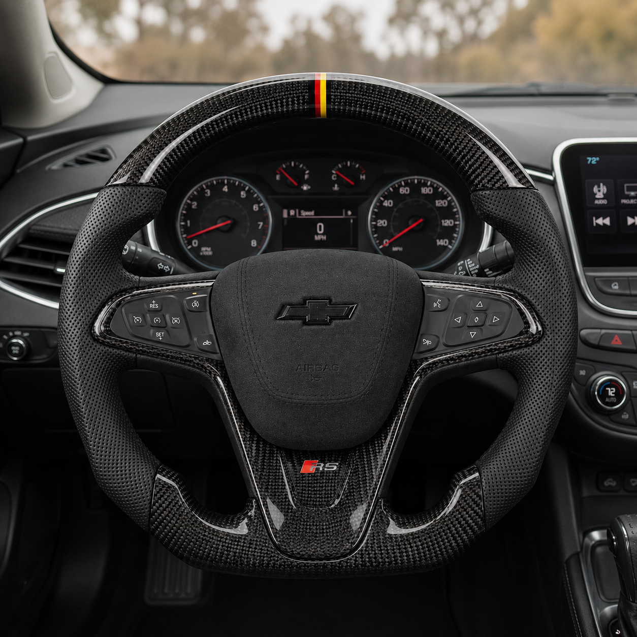 Custom Chevrolet Malibu Cruze steering wheel installed in vehicle interior with glossy carbon fiber black perforated leather grip RS badge and yellow red center stripe