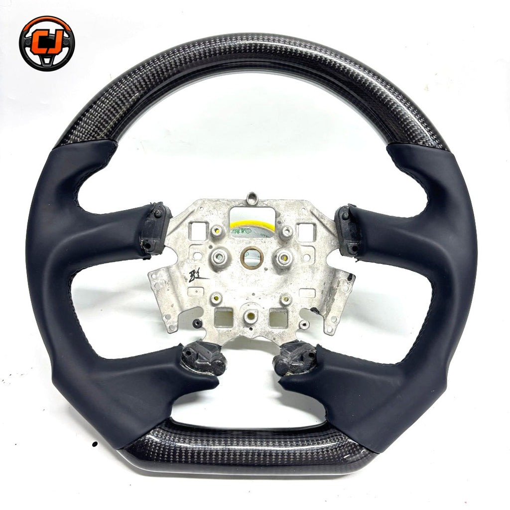 Ford Falcon FG MkII performance steering wheel crafted with carbon fiber upper and lower sections, leather wrapped sides and motorsport inspired design by CJ Mod Garage