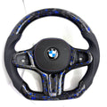 BMW forged carbon fiber steering wheel with blue flakes and perforated leather side grips on white background, custom flat-bottom performance steering wheel for BMW G02 G05 G06 G09 G11 G12 G15 G20 G22 G28 G29 G30 G38 G80 G82 F40 F90 – CJ Mod Garage