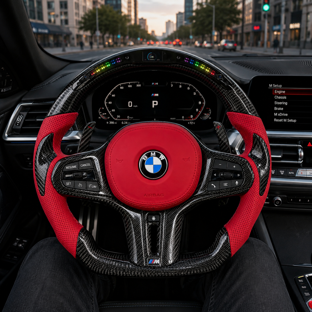BMW LED carbon fiber steering wheel with red perforated leather grips installed in BMW G80 G82 G20 interior, custom flat-bottom design by CJ Mod Garage