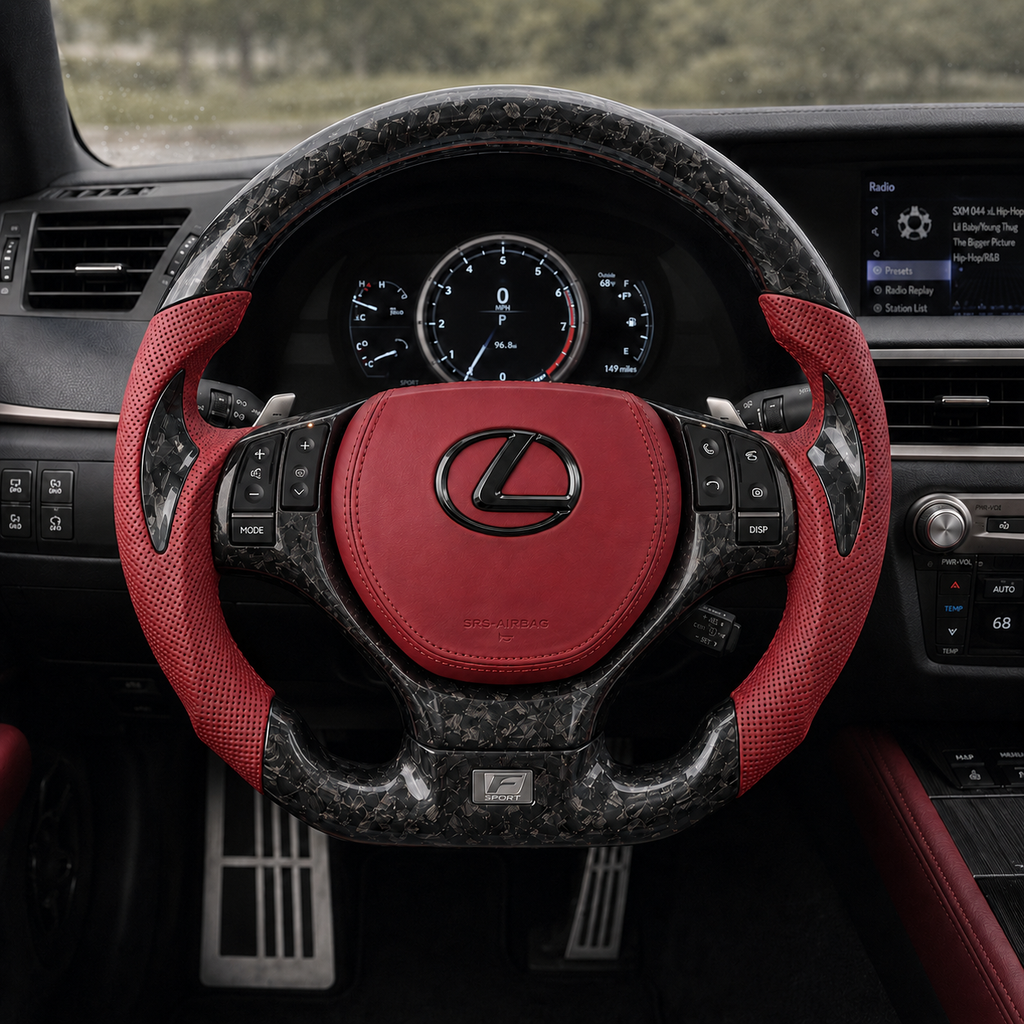 Front view of custom Lexus GS carbon fiber steering wheel with red perforated leather sides, red airbag cover and F Sport style badge