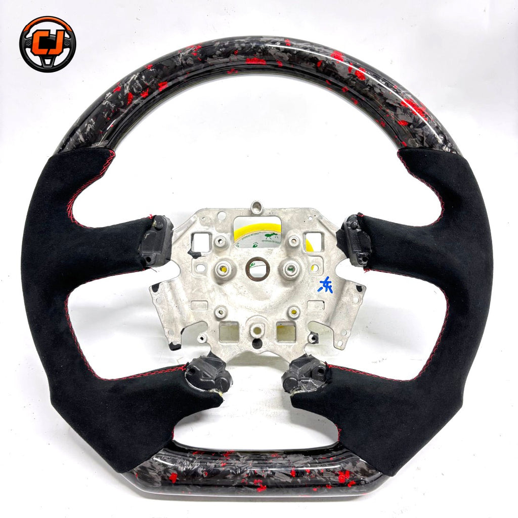 Front view of Ford Falcon FG XR XR6 XR8 custom steering wheel with red flake forged carbon black Alcantara and red stitching by CJ Mod Garage