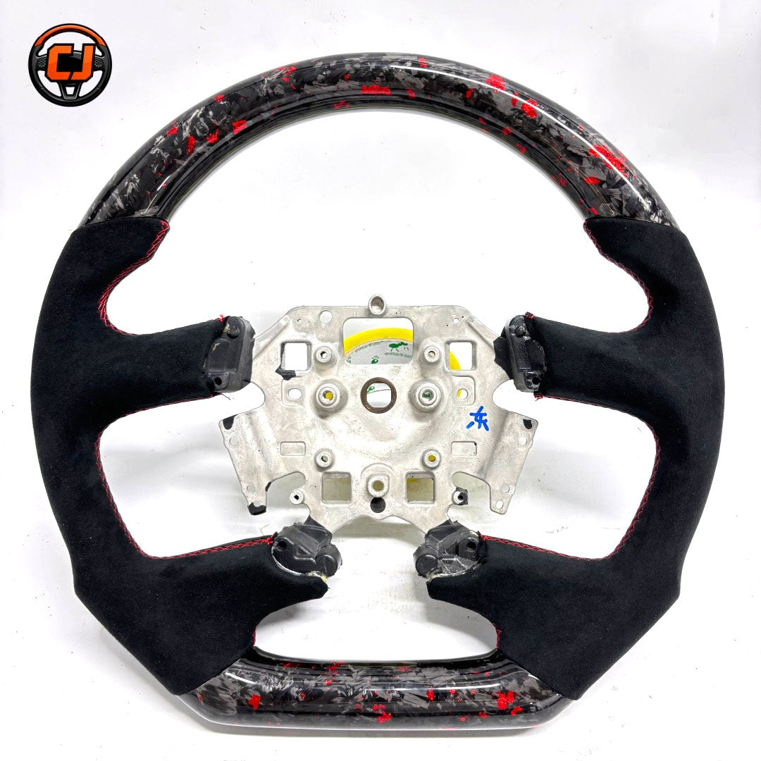 Front view of Ford Falcon FG XR XR6 XR8 custom steering wheel with red flake forged carbon black Alcantara and red stitching by CJ Mod Garage