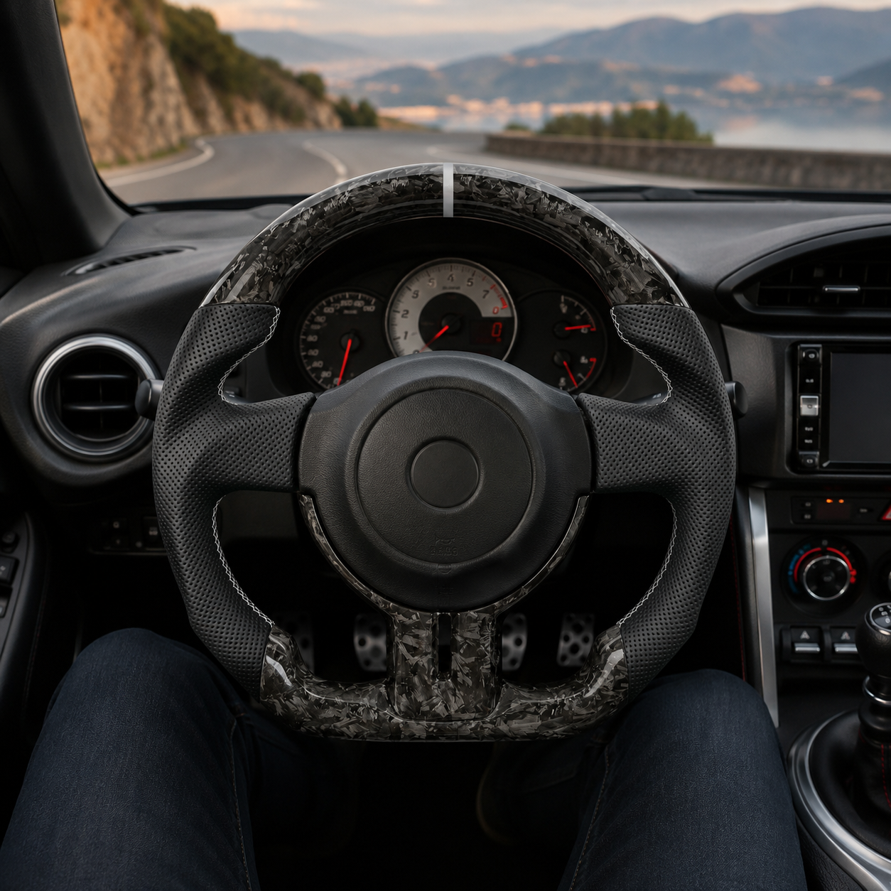 Toyota GT86 custom forged carbon steering wheel with gray flake carbon finish, perforated leather grips, white center marker and flat-bottom performance shape by CJ Mod Garage