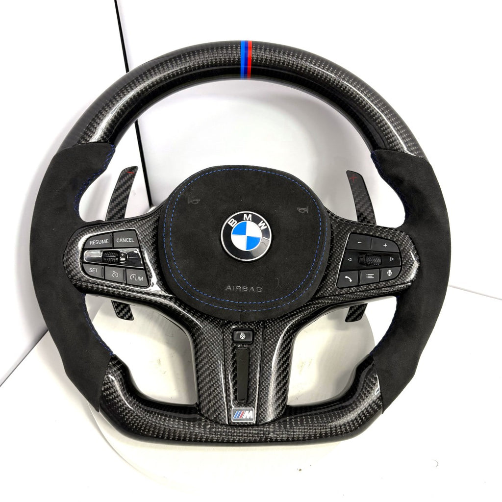 BMW M performance carbon fiber steering wheel with blue center stripe, Alcantara airbag cover and OEM controls for G28 G38 G82 F90 by CJ Mod Garage