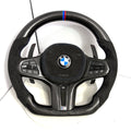 BMW M performance carbon fiber steering wheel with blue center stripe, Alcantara airbag cover and OEM controls for G28 G38 G82 F90 by CJ Mod Garage