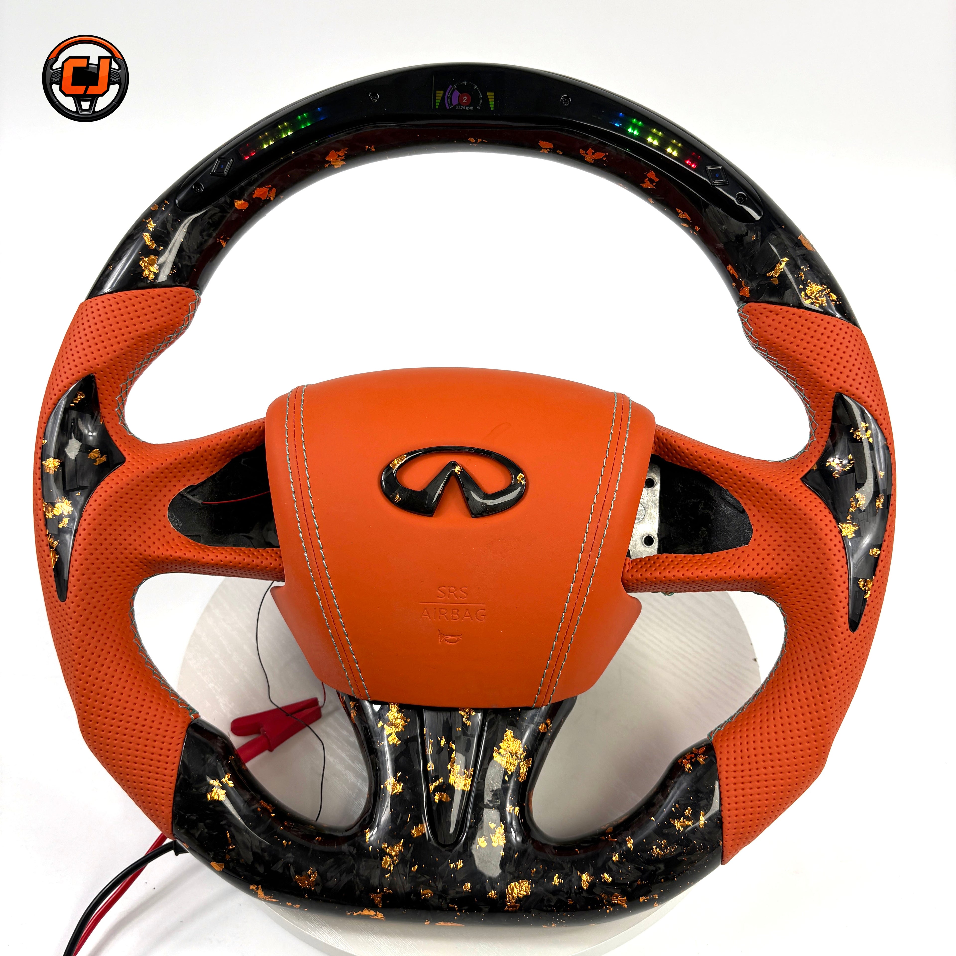 Infiniti Q50 Q60 custom forged carbon steering wheel featuring orange leather grips real gold flake carbon LED RPM display and flat bottom design by CJ Mod Garage