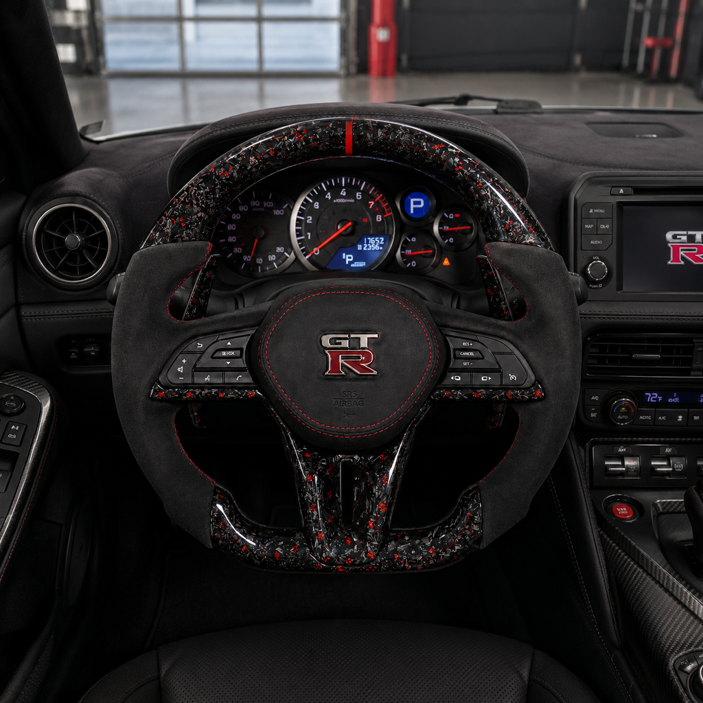 Nissan GT R R35 forged carbon steering wheel with red flakes Alcantara grips red center stripe and custom performance styling by CJ Mod Garage