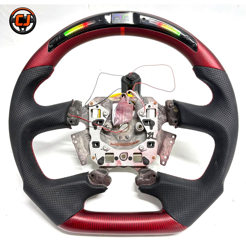 Front view of Ford Falcon FG XR XR6 XR8 custom steering wheel with LED display red carbon fiber and black perforated leather by CJ Mod Garage
