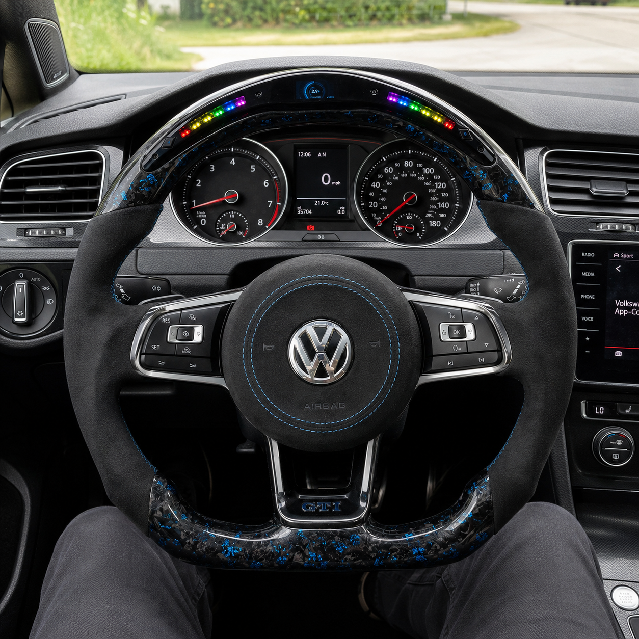 Volkswagen Golf GTI Mk7 blue forged carbon LED wheel with airbag cover shown in cabin CJ Mod Garage