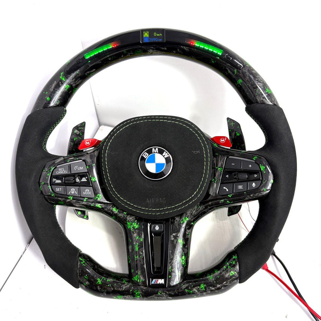 BMW M performance steering wheel featuring green forged carbon fiber, Alcantara side grips and digital LED display compatible with G20 G28 G38 G80 F90 by CJ Mod Garage