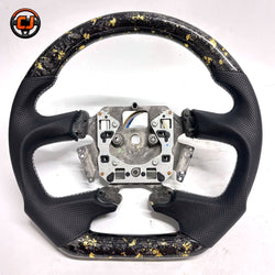 Front view of Ford Falcon FG XR XR6 XR8 custom steering wheel with gold flake forged carbon and black perforated leather by CJ Mod Garage