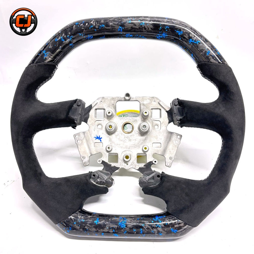 Front view of Ford Falcon FG XR XR6 XR8 custom steering wheel with blue flake forged carbon and black Alcantara by CJ Mod Garage
