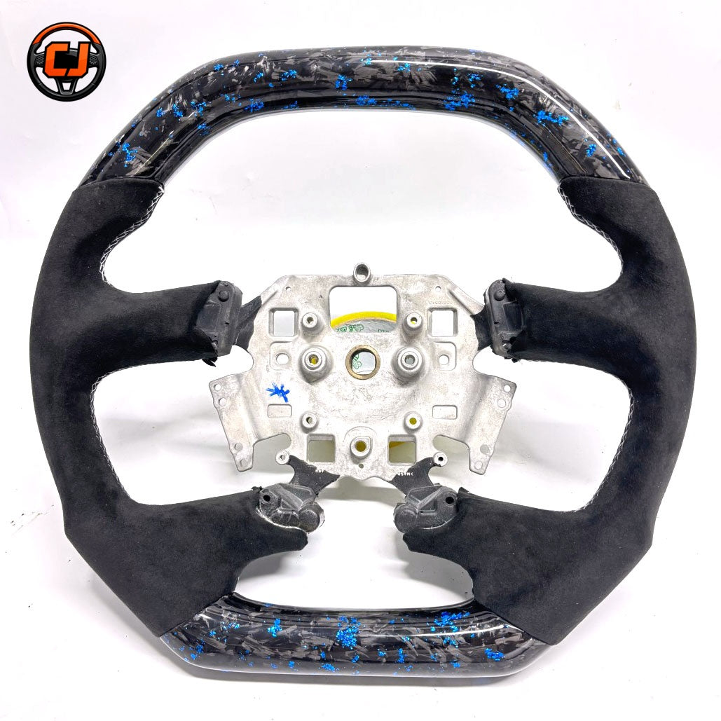 Front view of Ford Falcon FG XR XR6 XR8 custom steering wheel with blue flake forged carbon and black Alcantara by CJ Mod Garage