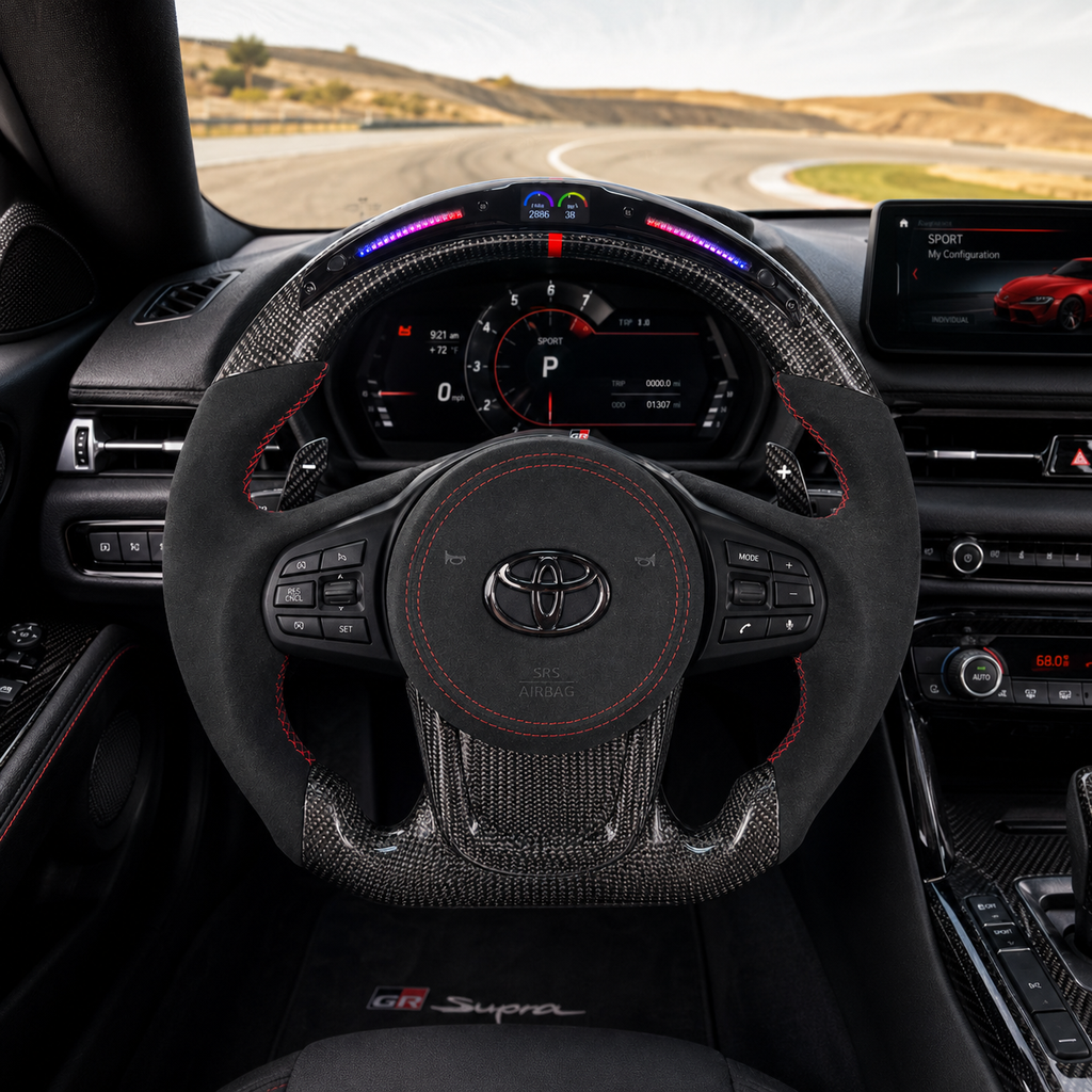 Toyota GR Supra A90 A91 custom carbon fiber steering wheel with LED shift indicator, Alcantara grips, red stitching and digital display cockpit view by CJ Mod Garage