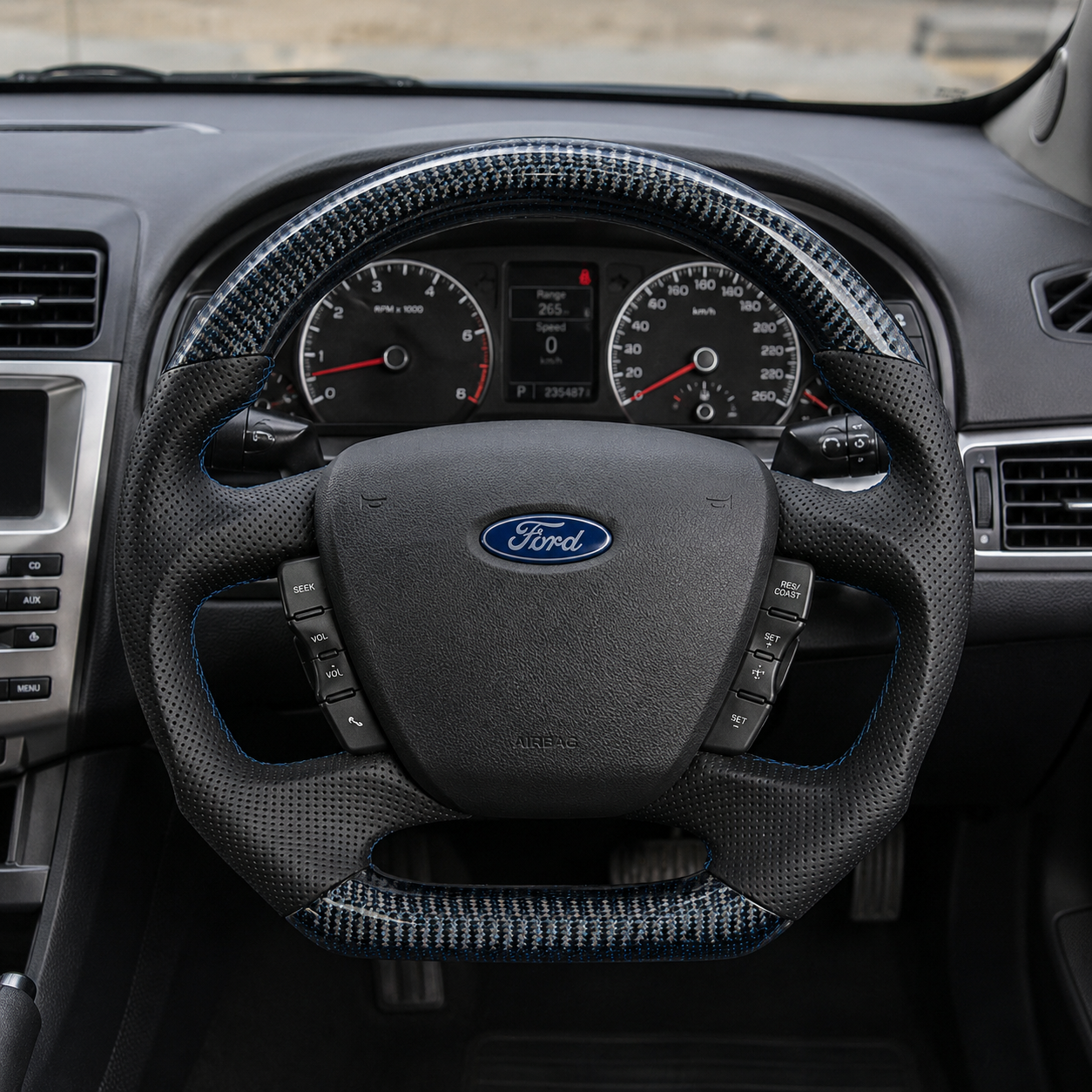 Ford Falcon FG XR XR6 XR8 custom steering wheel installed in car with blue carbon fiber black perforated leather and blue stitching by CJ Mod Garage