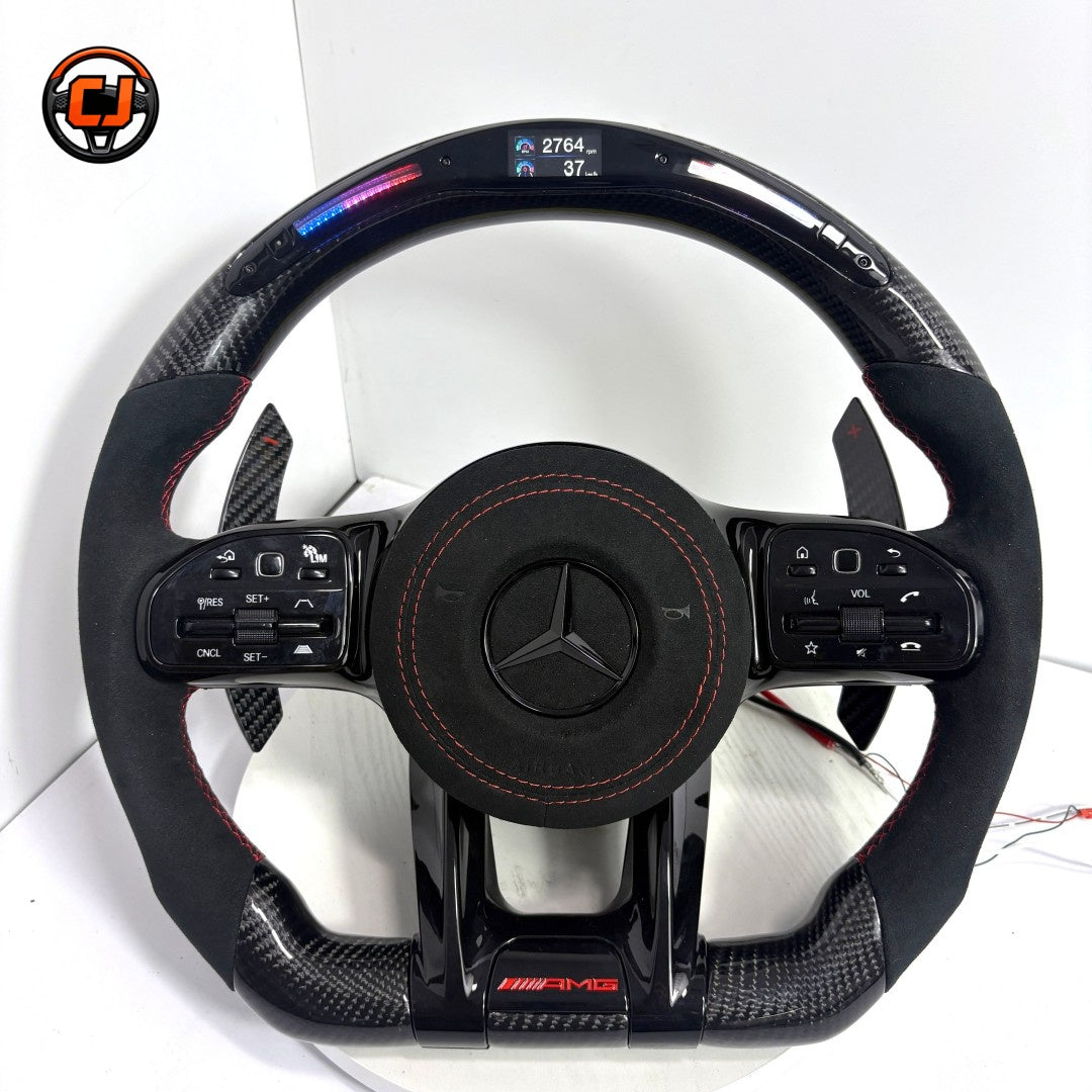 Mercedes AMG custom carbon fiber steering wheel featuring Alcantara side grips, digital LED display and paddle shifters for W117 W205 W218 C43 C63 by CJ Mod Garage