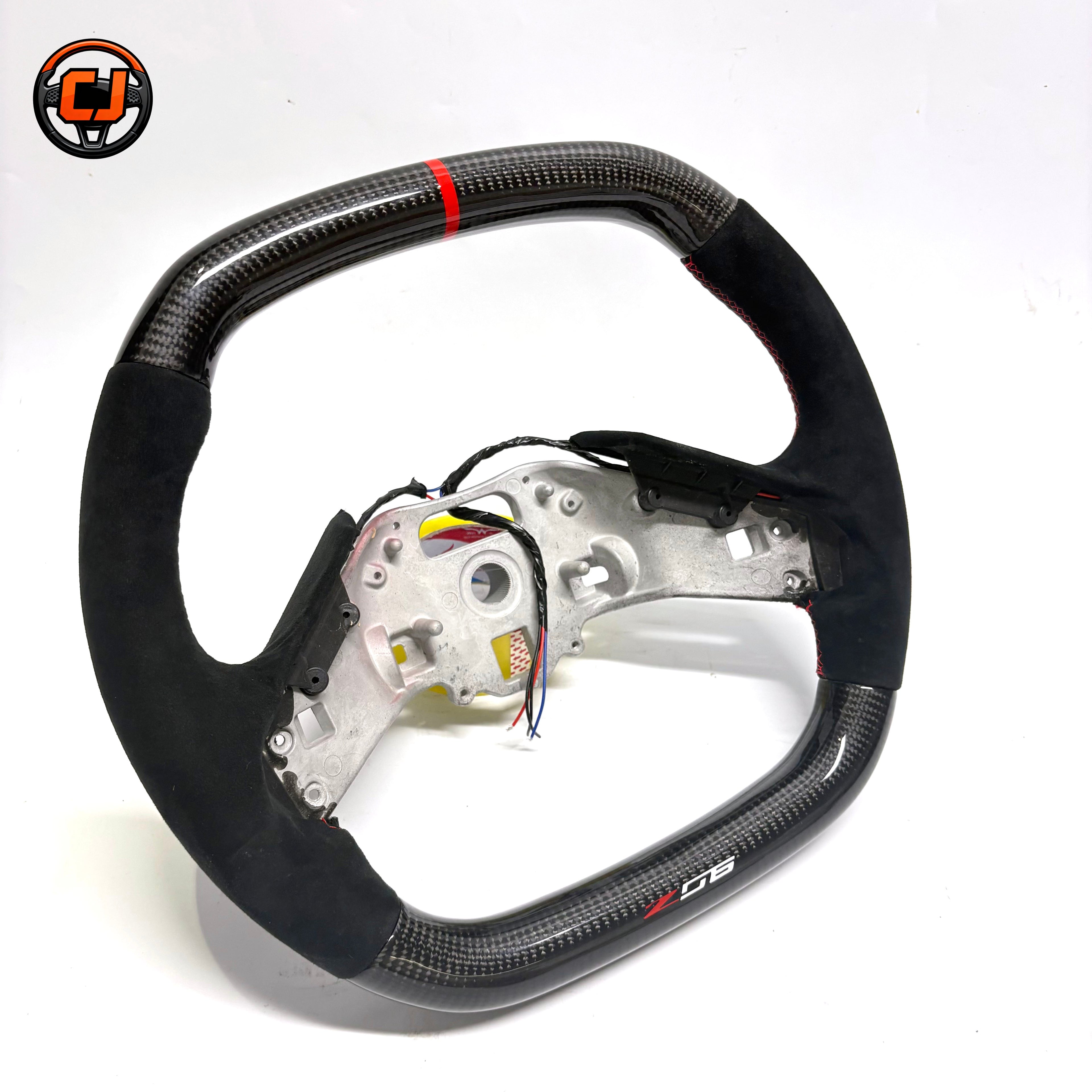 custom Chevrolet Corvette C8 Z06 style steering wheel rear view with gloss carbon fiber red center stripe black suede grips red stitching aluminum frame and exposed wiring