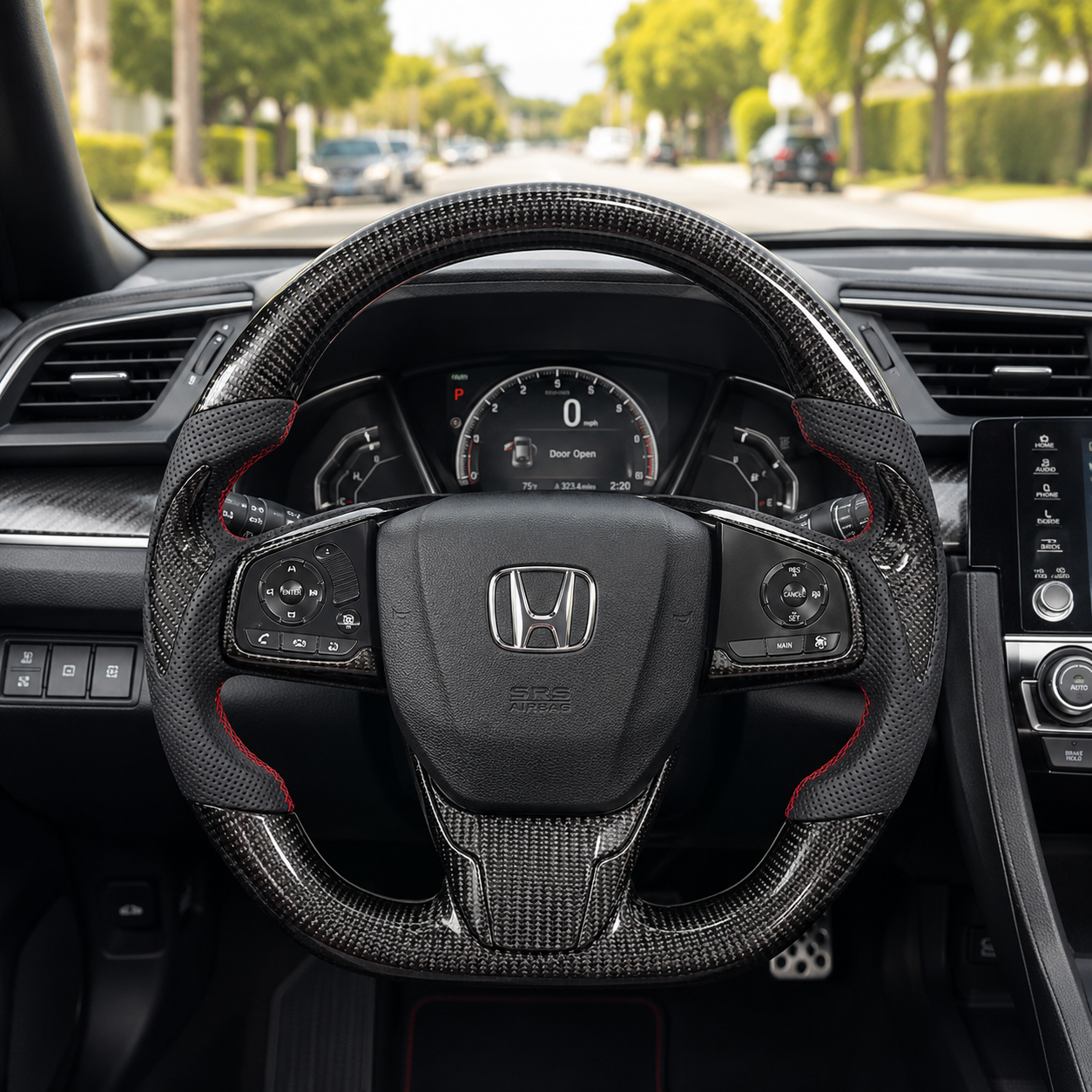 Honda Civic 10th Gen custom carbon fiber steering wheel with perforated leather grips and red stitching installed interior view by CJ Mod Garage