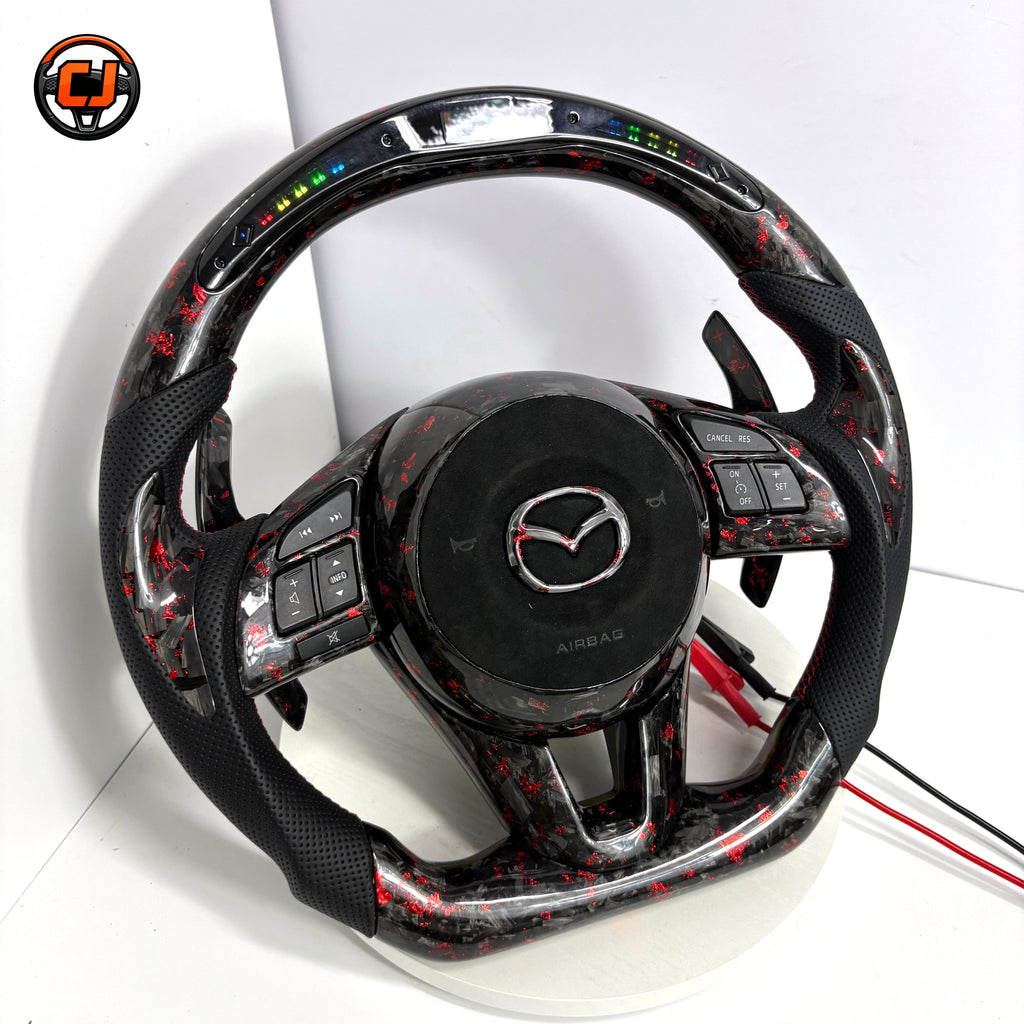 Custom Mazda 3 Axela LED steering wheel with forged carbon red flakes black perforated leather grips red stitching paddle shifters and flat bottom design