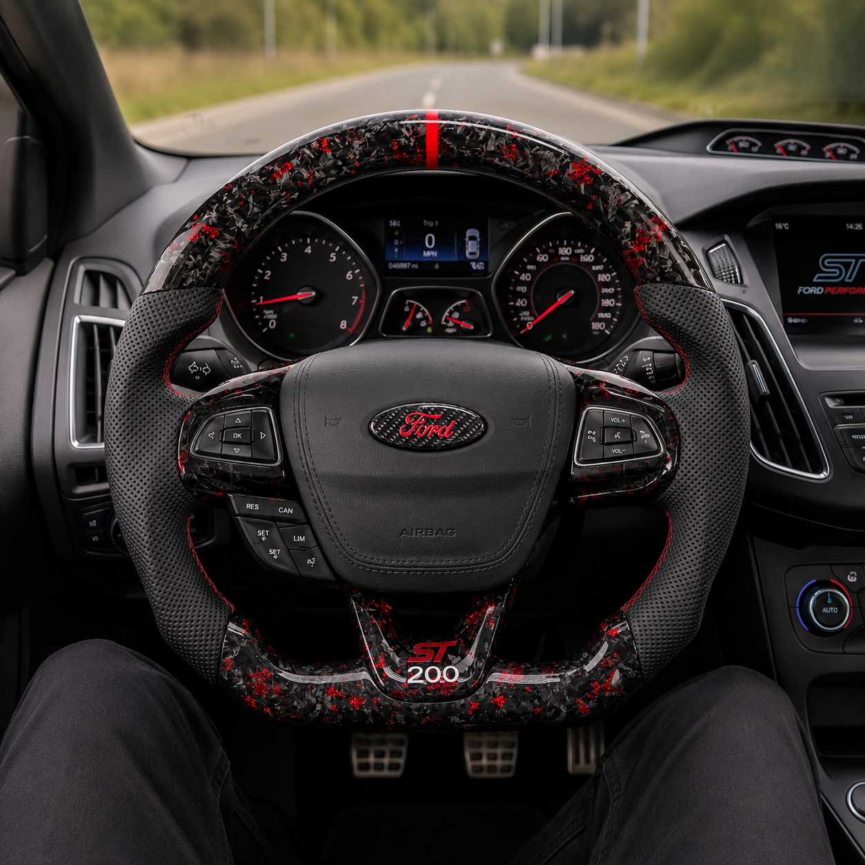 Ford Focus ST custom forged carbon fiber steering wheel with red metallic flakes, perforated leather grips, red center stripe and OEM-style airbag cover installed by CJ Mod Garage