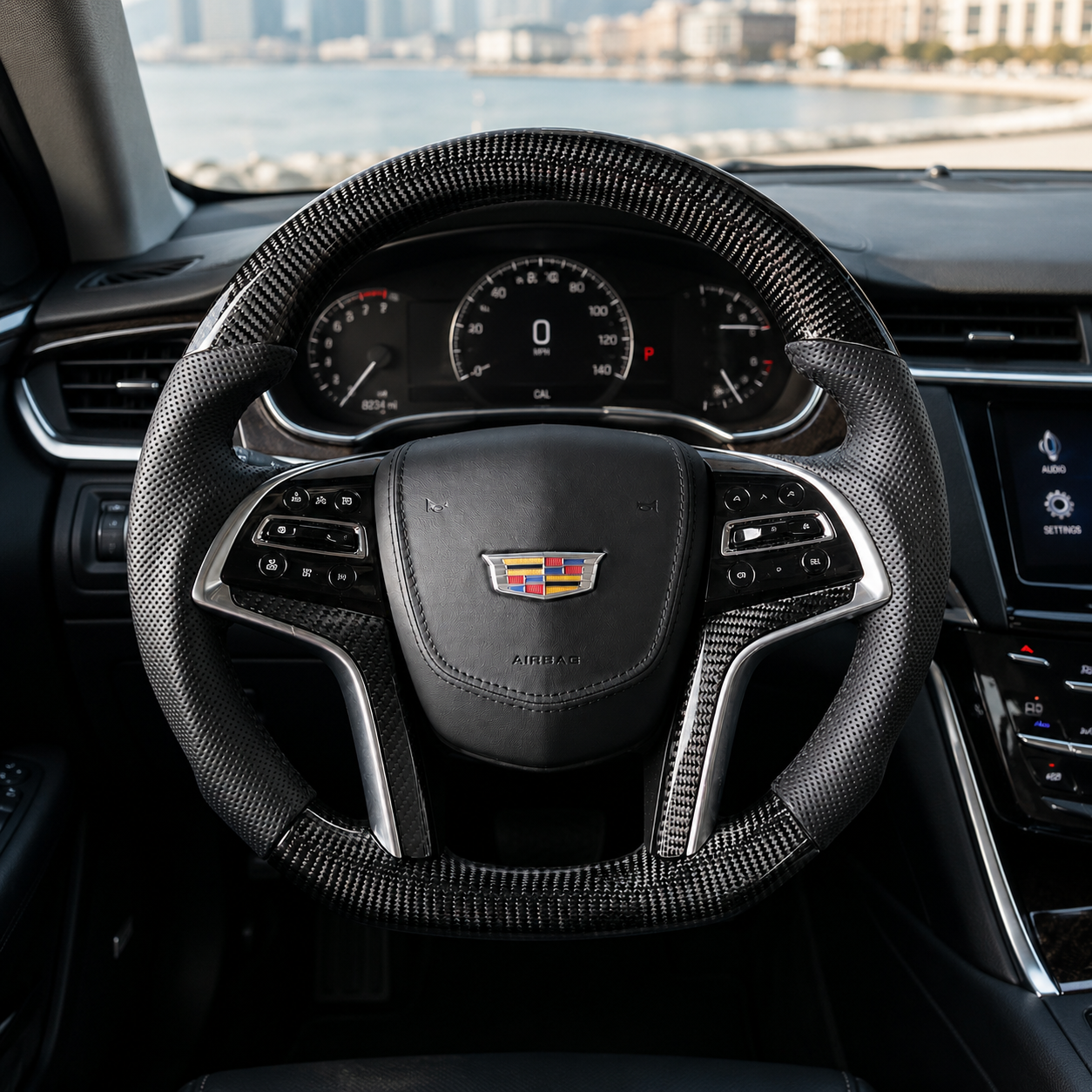 Cadillac XTS custom carbon fiber steering wheel installed in cockpit with glossy weave and leather grips by CJ Mod Garage
