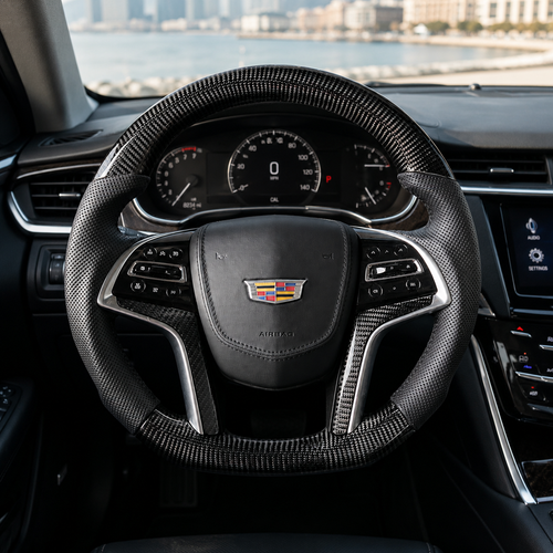 Cadillac XTS custom carbon fiber steering wheel installed in cockpit with glossy weave and leather grips by CJ Mod Garage