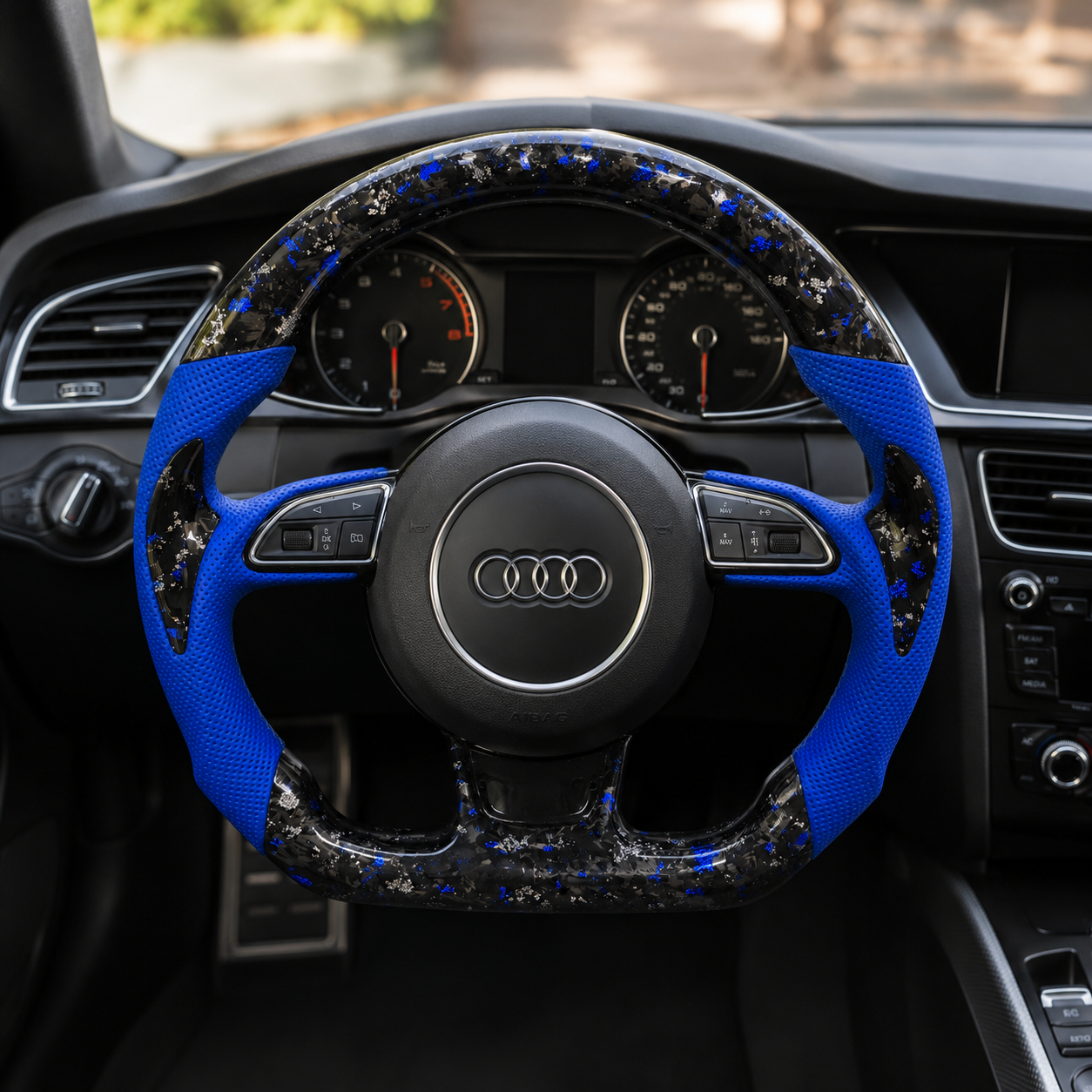 Audi B8 forged carbon blue steering wheel installed in Audi A5 interior - driver perspective