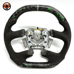 Front view of Ford Falcon FG XR XR6 XR8 custom steering wheel with green flake forged carbon white center marker and black Alcantara by CJ Mod Garage