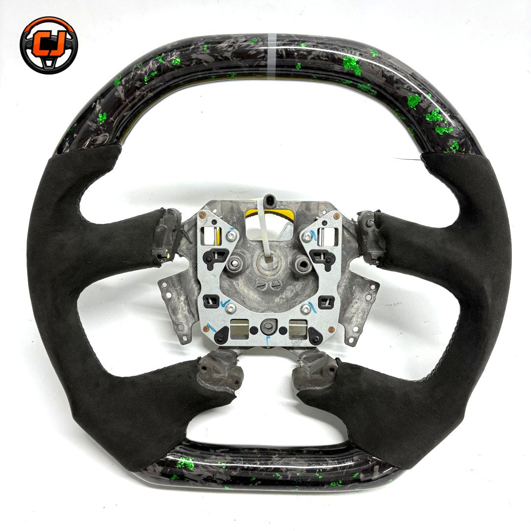 Front view of Ford Falcon FG XR XR6 XR8 custom steering wheel with green flake forged carbon white center marker and black Alcantara by CJ Mod Garage
