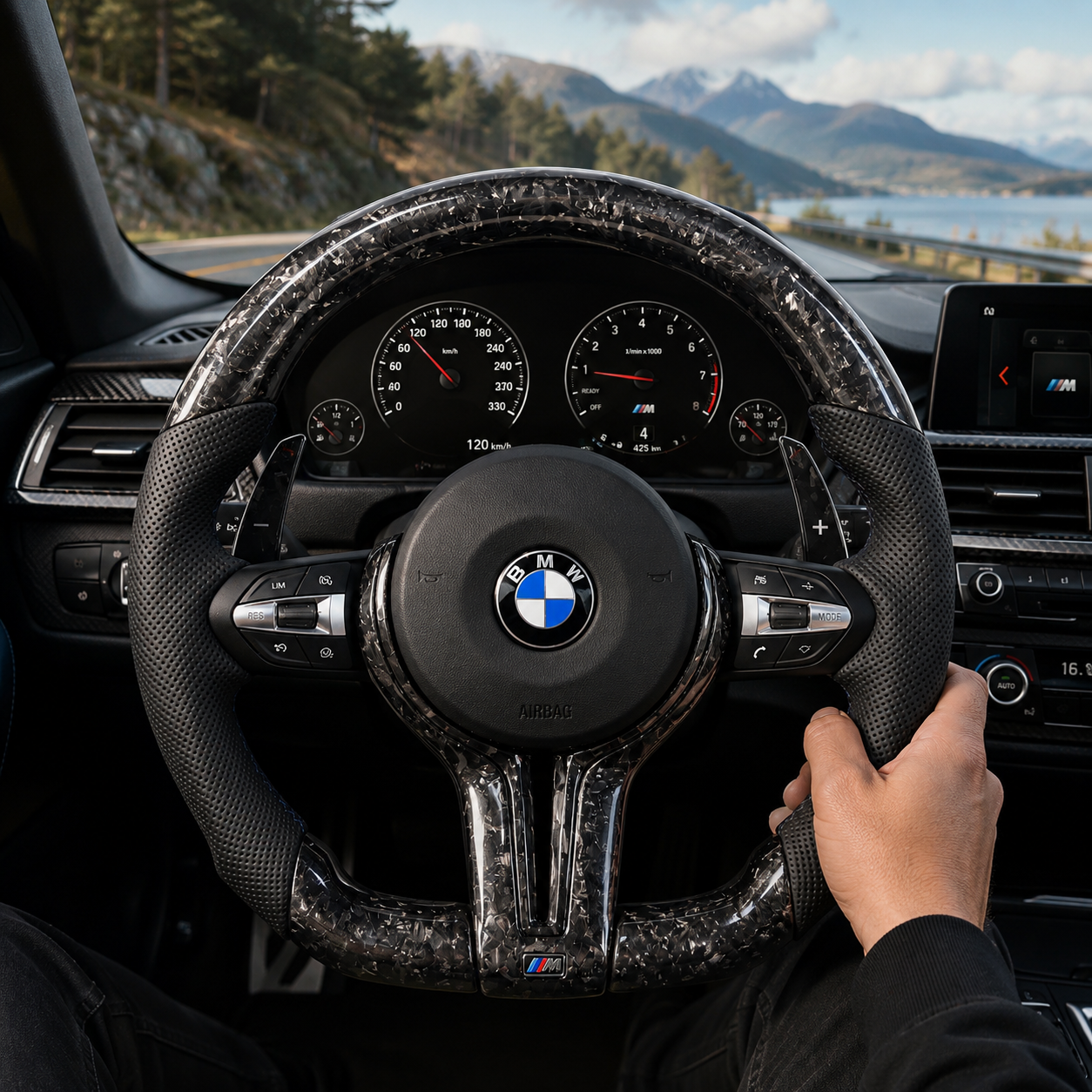 Custom BMW forged carbon fiber steering wheel with black perforated leather grips and sport paddle shifters installed in BMW F10 F11 F15 F18 F20 F23 F25 F30 F32 F35 F40 F80 E84 E87 E90 E92 E93 interior driving scene