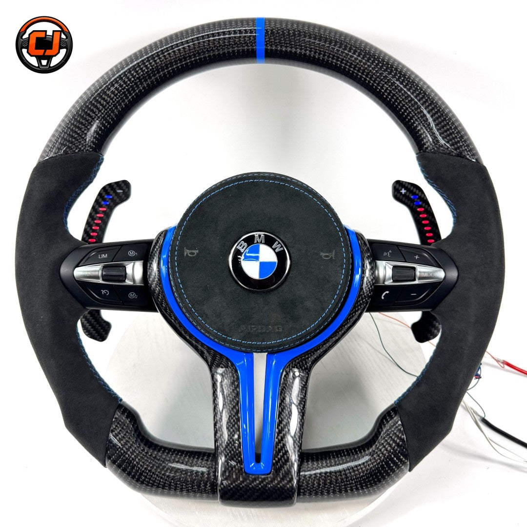 Blue accent BMW custom carbon fiber steering wheel with Alcantara grips, multifunction controls, illuminated paddle shifters, and sport round airbag design for BMW F10 F11 F15 F18 F20 F23 F25 F30 F32 F35 F40 F80 E84 E87 E90 E92 E93