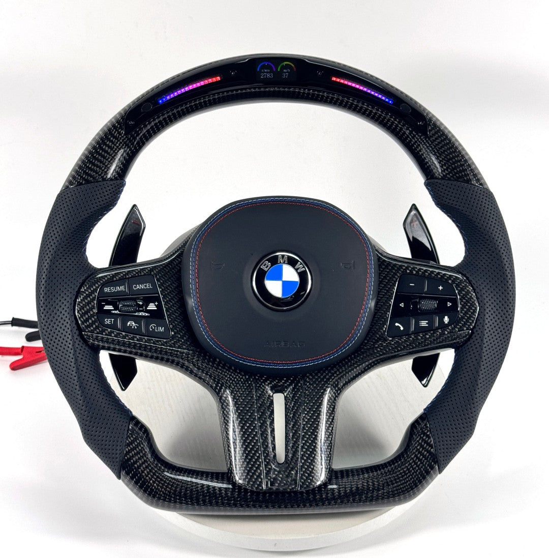 BMW performance steering wheel featuring illuminated LED indicator, premium carbon fiber and ergonomic leather handles for G02 G05 G06 G20 G28 G80 G82 F40 F90 by CJ Mod Garage