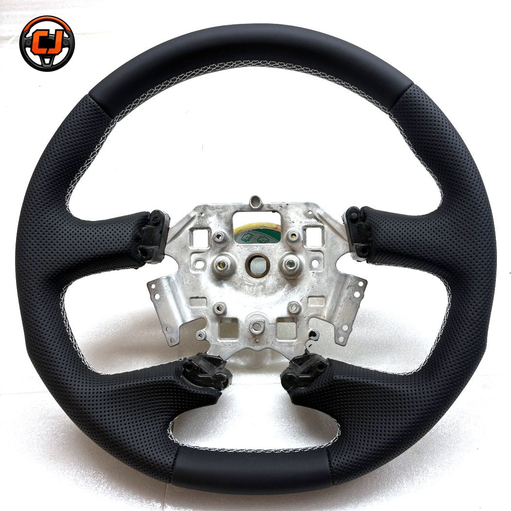 Front view of Ford Falcon FG XR XR6 XR8 custom steering wheel with smooth black leather perforated grips and white contrast stitching by CJ Mod Garage