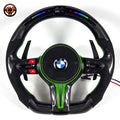 Green accent BMW custom carbon fiber steering wheel with suede grips, multifunction controls, LED shift indicator display, and sport paddle shifters for BMW F10 F11 F15 F18 F20 F23 F25 F30 F32 F35 F40 F80 E84 E87 E90 E92 E93