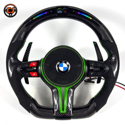 Green accent BMW custom carbon fiber steering wheel with suede grips, multifunction controls, LED shift indicator display, and sport paddle shifters for BMW F10 F11 F15 F18 F20 F23 F25 F30 F32 F35 F40 F80 E84 E87 E90 E92 E93
