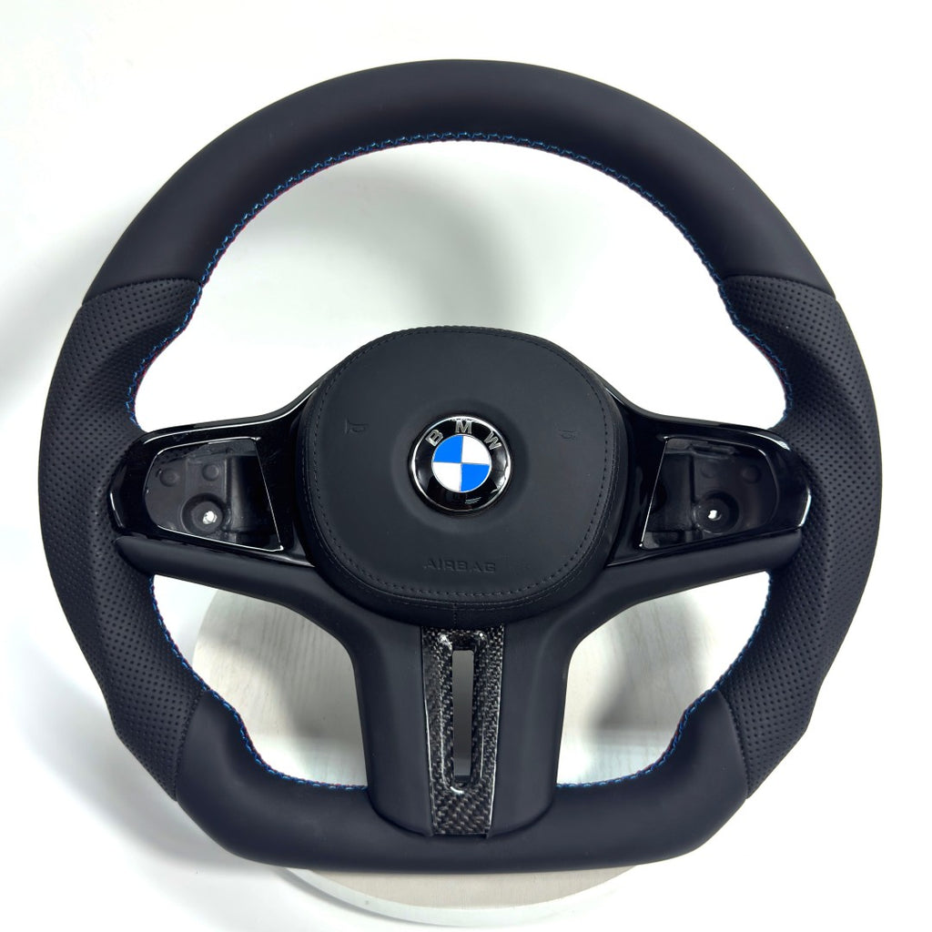 BMW sport leather steering wheel with ergonomic D-shape design, blue-red M stitching and carbon fiber accent for G09 G11 G12 G15 G20 G28 F40 F90 by CJ Mod Garage
