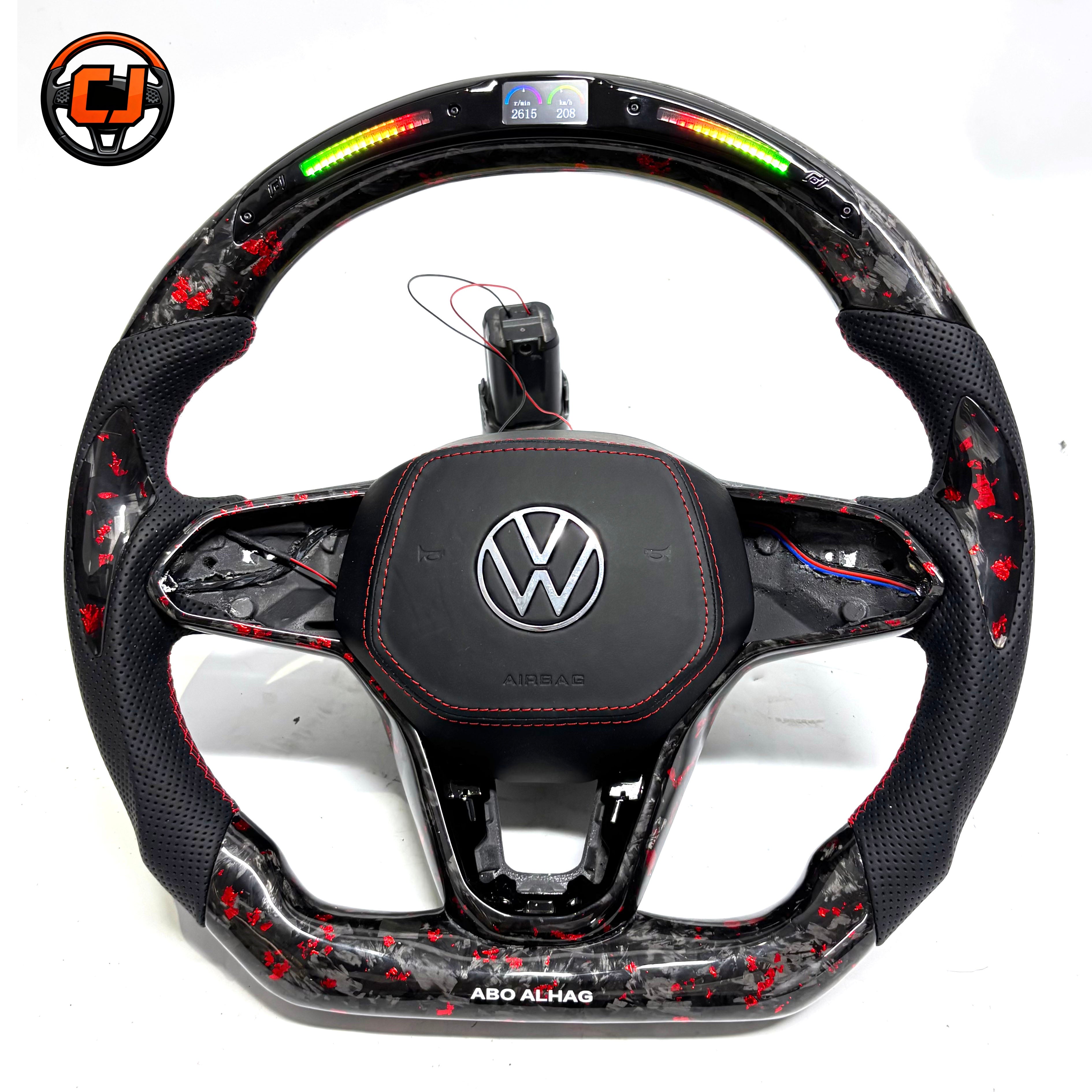 Hand built steering wheel with forged carbon red flakes perforated leather sections illuminated shift lights and premium airbag cover for Golf 8 MK8 Passat Touareg Tiguan Polo GTD MK7 MK6 R Line CC Jetta by CJ Mod Garage