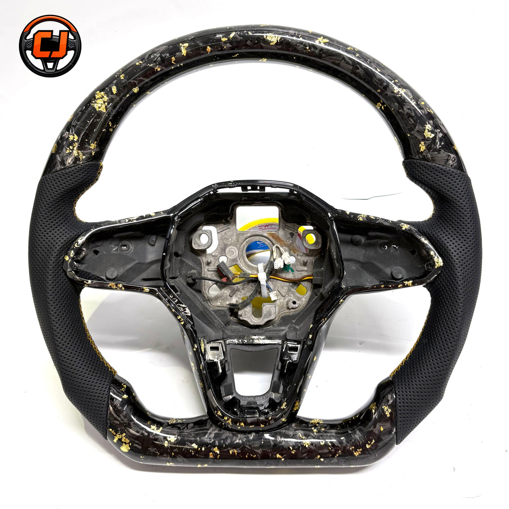 Handcrafted sport steering wheel with black forged carbon gold flake accents perforated side grips and OEM fitment for Golf 8 MK8 Passat Touareg Tiguan Polo GTD MK7 MK6 R Line CC Jetta by CJ Mod Garage
