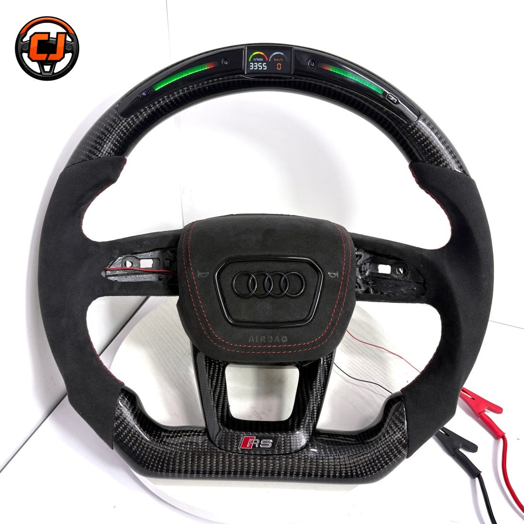 gloss carbon fiber steering wheel, alcantara audi steering wheel, audi led steering wheel, audi q5 custom steering wheel, audi q7 carbon fiber wheel, audi q8 led steering wheel, audi q3 alcantara wheel, audi a3 sport steering wheel, audi a4 carbon fiber steering, audi a6 custom led wheel, audi a7 performance steering wheel, flat bottom audi steering wheel, red stripe audi steering wheel, luxury audi interior upgrade, audi sport custom steering wheel