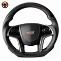 Cadillac XTS carbon fiber steering wheel front view with perforated leather grips and OEM style airbag cover by CJ Mod Garage