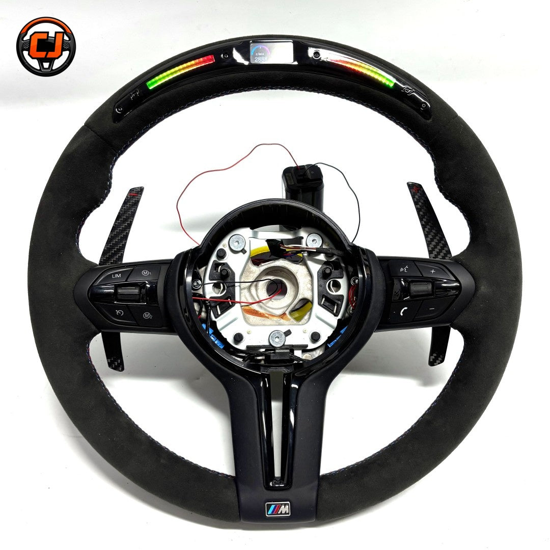BMW F Series LED steering wheel with Alcantara wrap, carbon fiber paddle shifters, and integrated shift light display