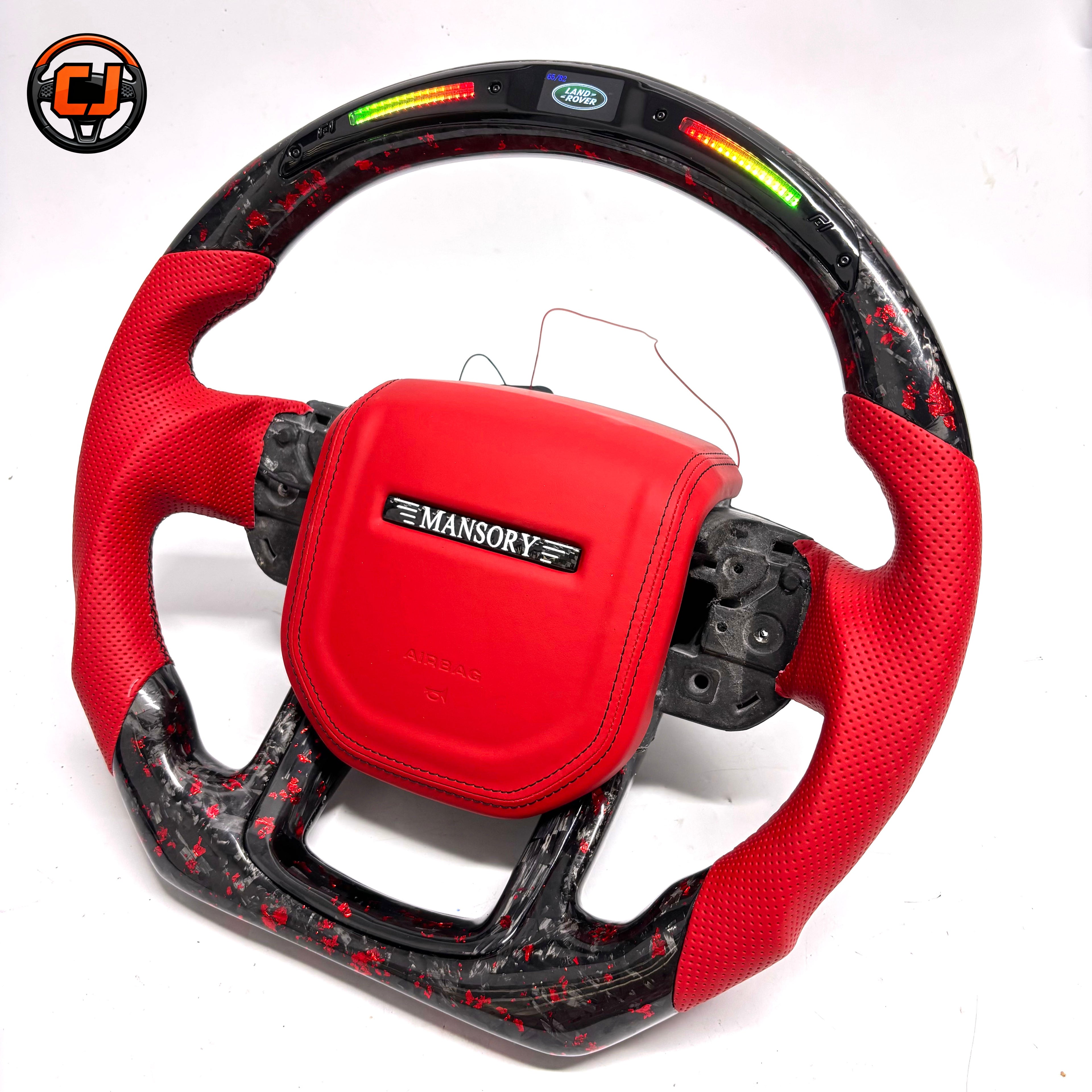Custom Land Rover Range Rover steering wheel with red perforated leather grips, red leather airbag cover, black forged carbon fiber with red flakes, LED shift lights and top display