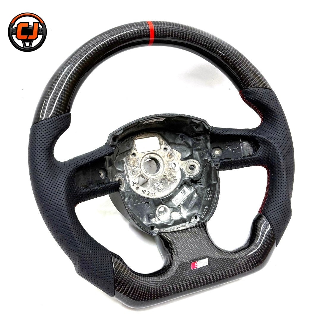 Audi B8 gloss carbon fiber perforated leather steering wheel - rear view showing round airbag platform and S-line badge