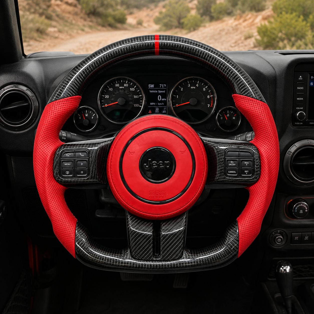 Custom Jeep Wrangler carbon fiber steering wheel installed in off-road interior with red perforated leather side grips, red airbag cover, glossy carbon fiber rim and flat bottom design